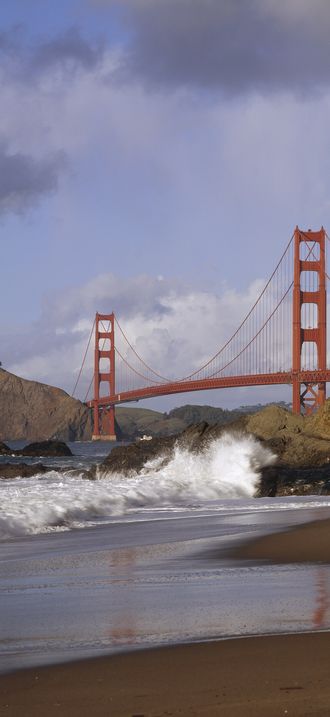 Crashing surf below the Golden Gate Bridge, San Francisco, California
