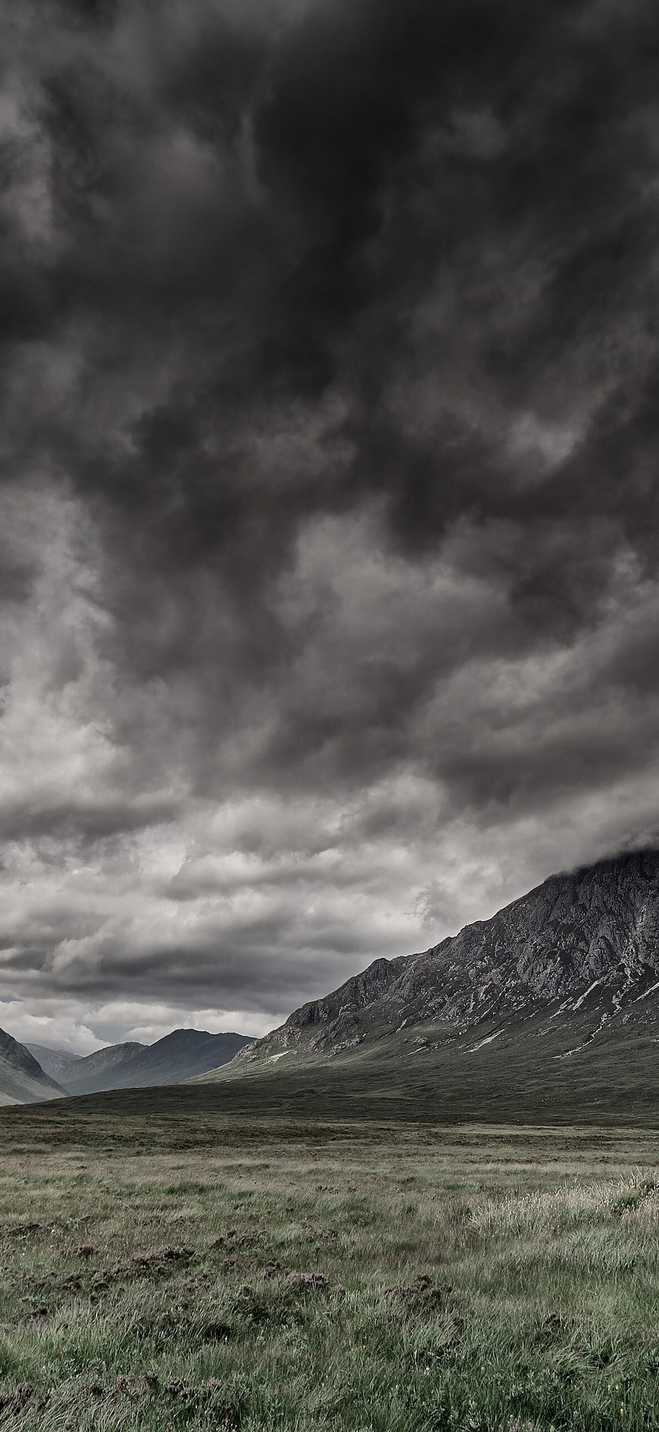 Dark clouds above the hilly valley