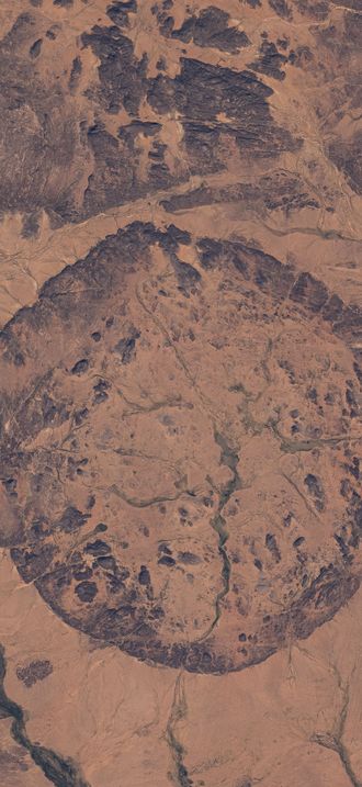 Ancient settlements surround this circular, geological feature in Mali