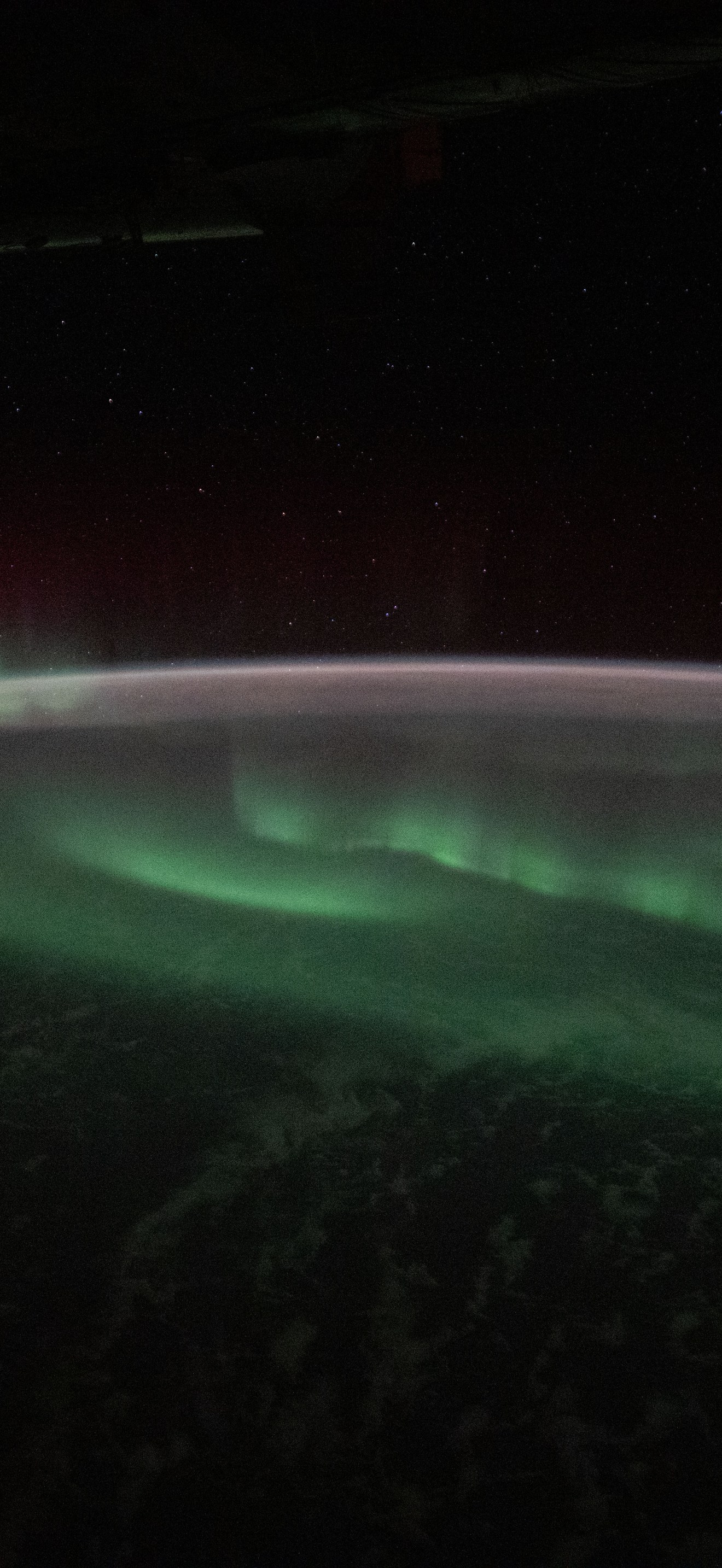 The aurora australis appears above the Indian Ocean southwest of Australia