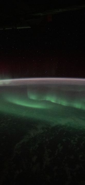 The aurora australis appears above the Indian Ocean southwest of Australia