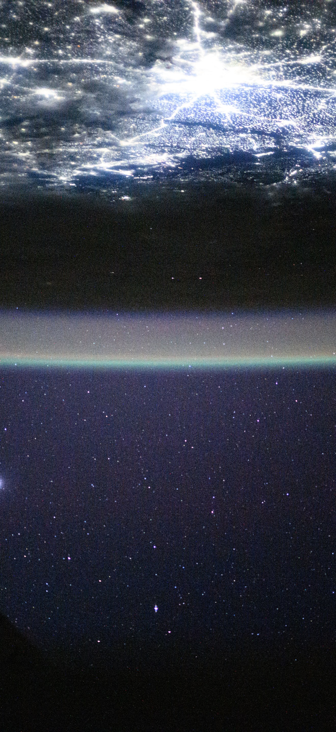 The city lights of New Delhi, India, underneath a starry night sky