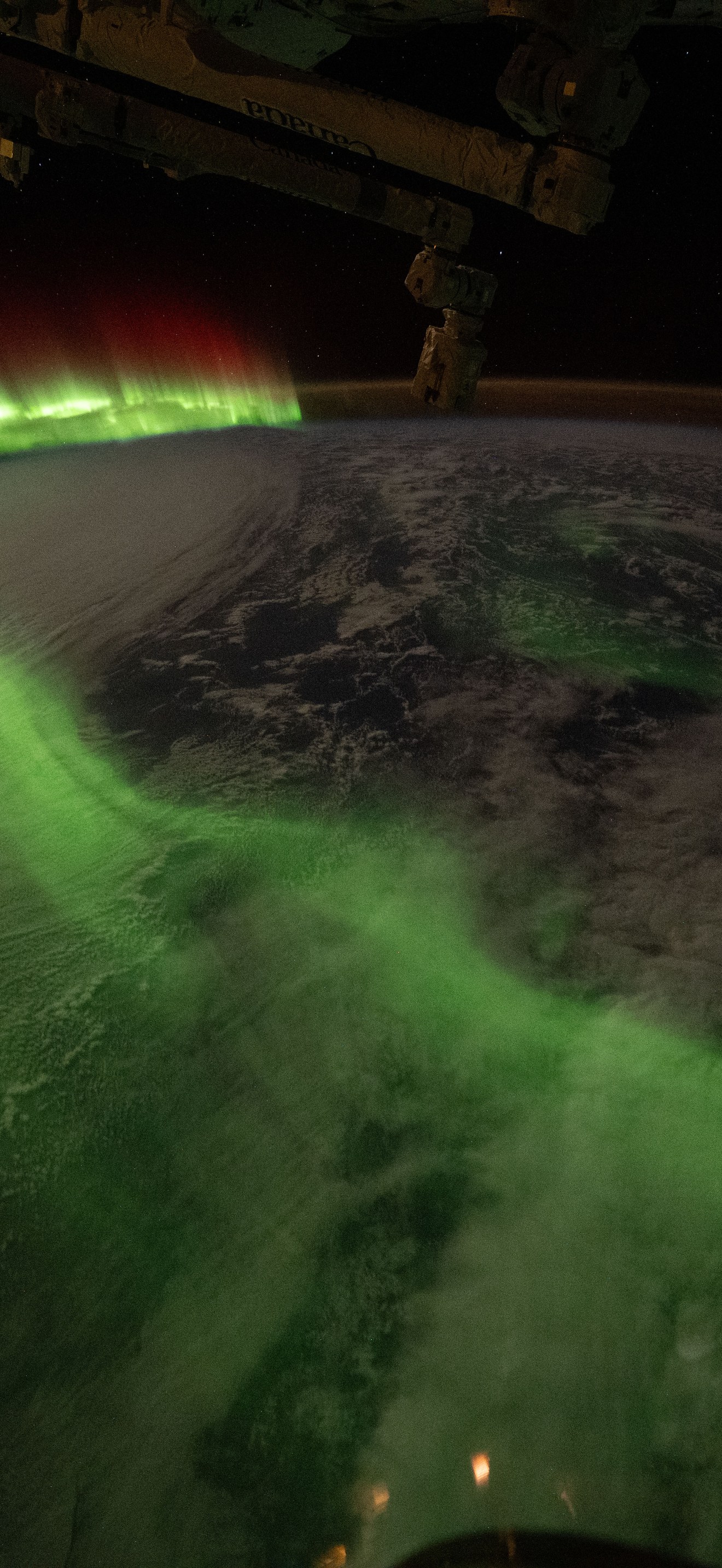 The aurora australis arcs over Earth during an active solar event