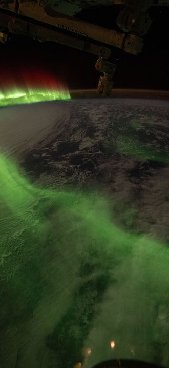 The aurora australis arcs over Earth during an active solar event