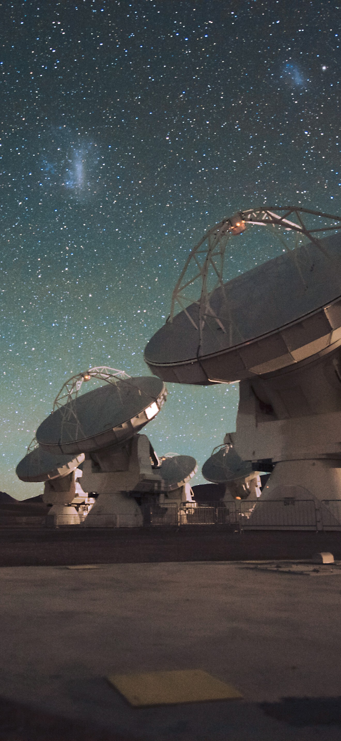 The Atacama Large Millimeter/submillimeter Array (ALMA) by night, under the Magellanic Clo