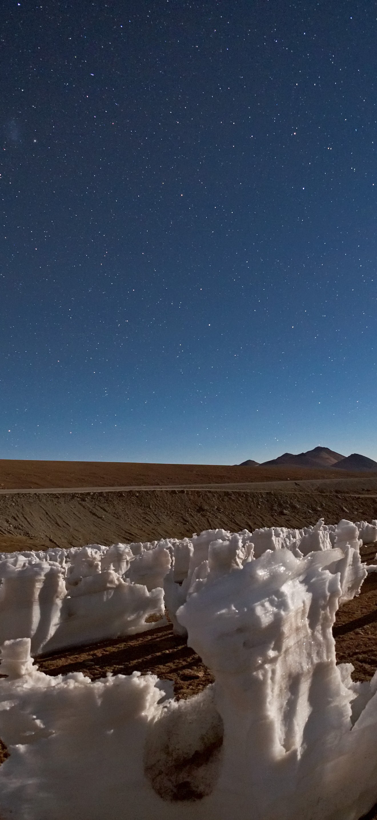 Icy penitents by moonlight on Chajnantor