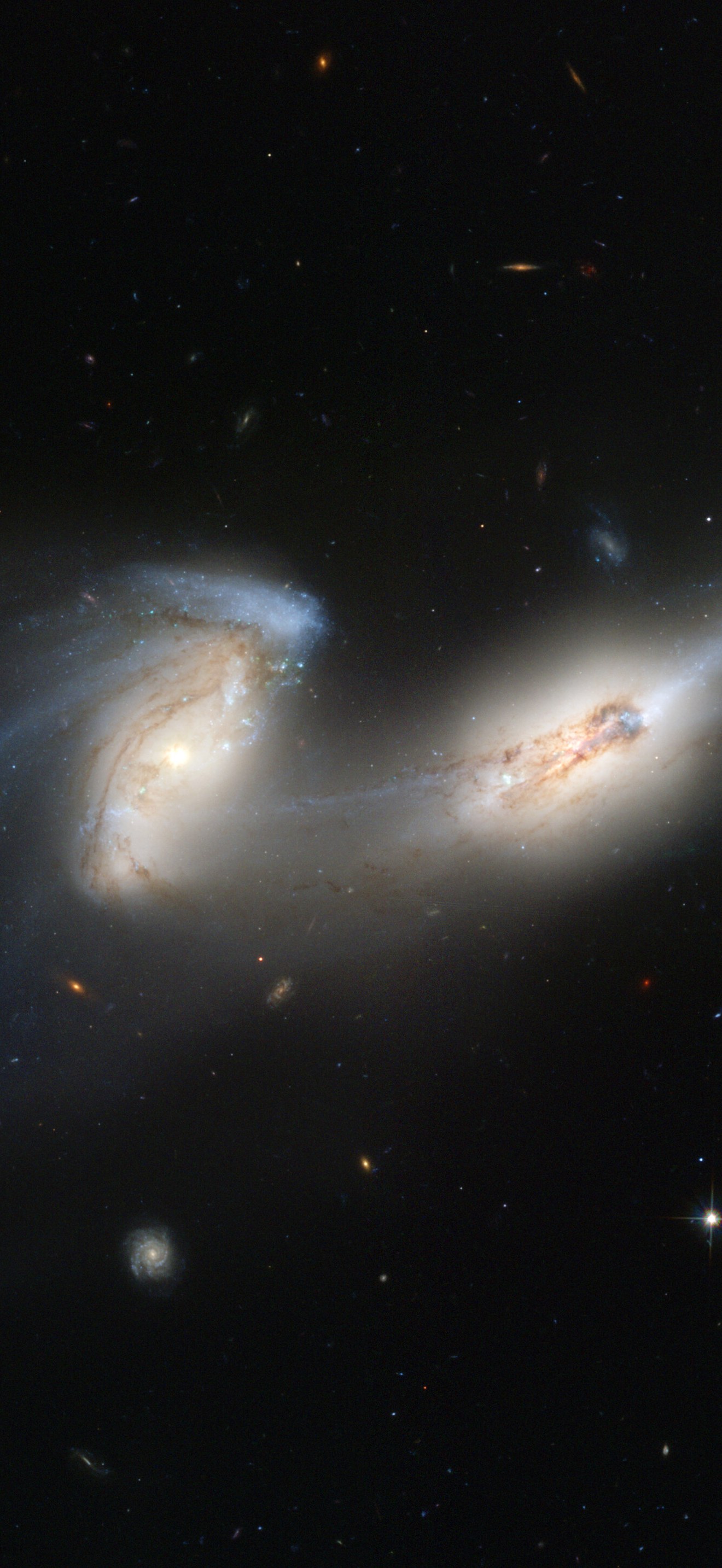 Hubble's newest camera takes a deep look at two merging galaxies
