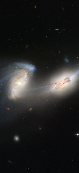 Hubble's newest camera takes a deep look at two merging galaxies