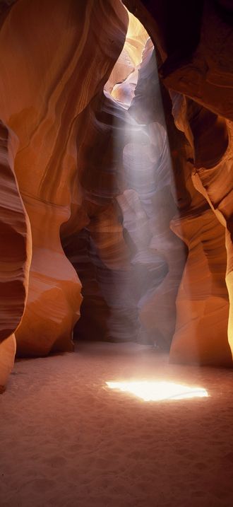 Light beams into an Arizona "slot canyon" near Page, Arizona