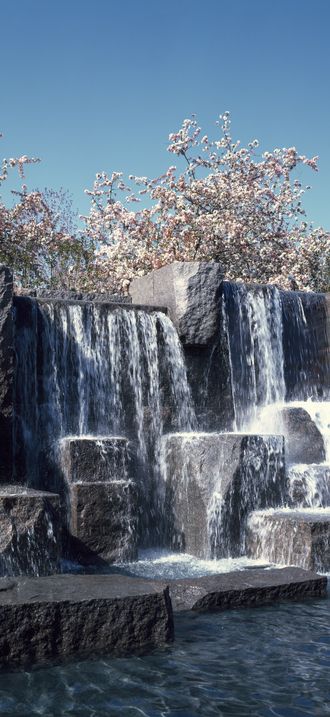Waterfall and cherry trees at the Franklin Delano Roosevelt Memorial, Washington, D.C
