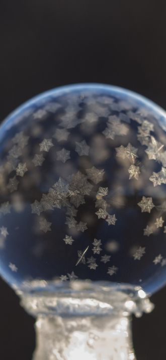 Tiny frozen bubble snowflakes