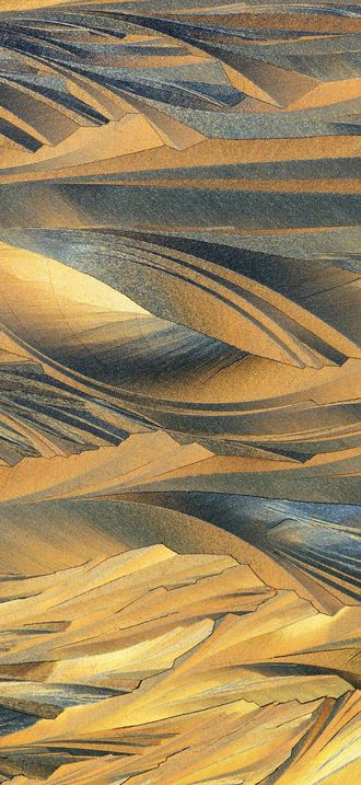 Microscopic image of crystals growing from melted sulfur