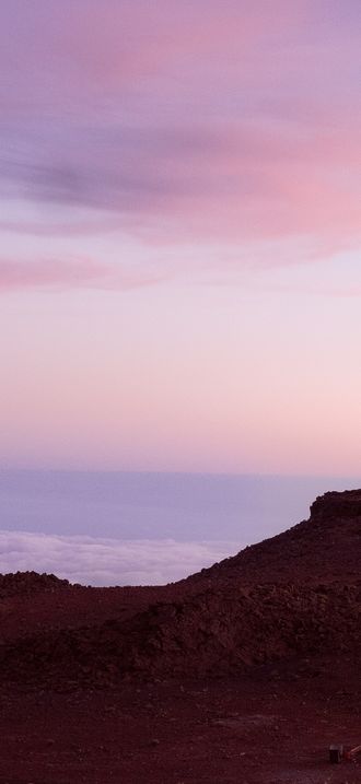 Haleakala Observatory above sunset clouds (Unsplash)