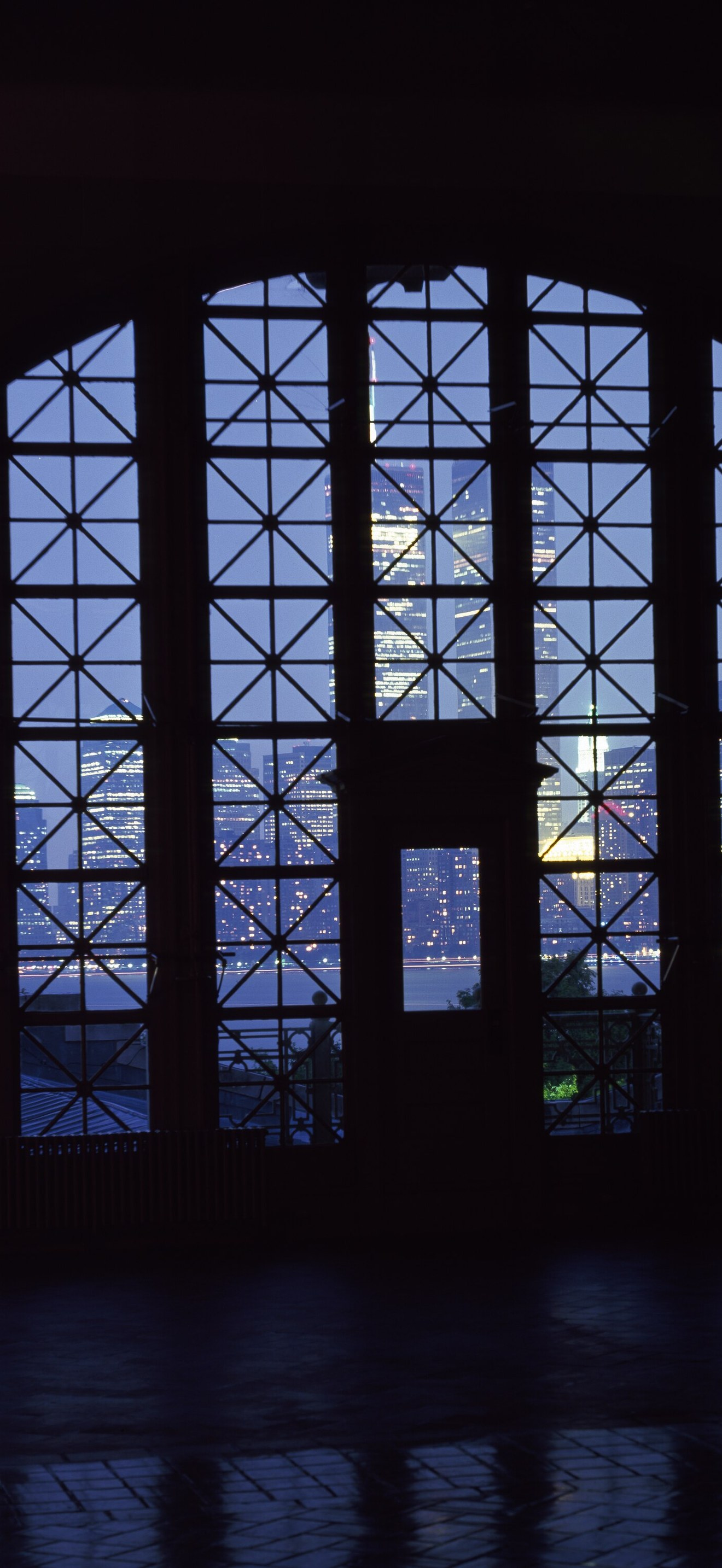 View of World Trade Center towers and the lower Manhattan skyline through registry room wi